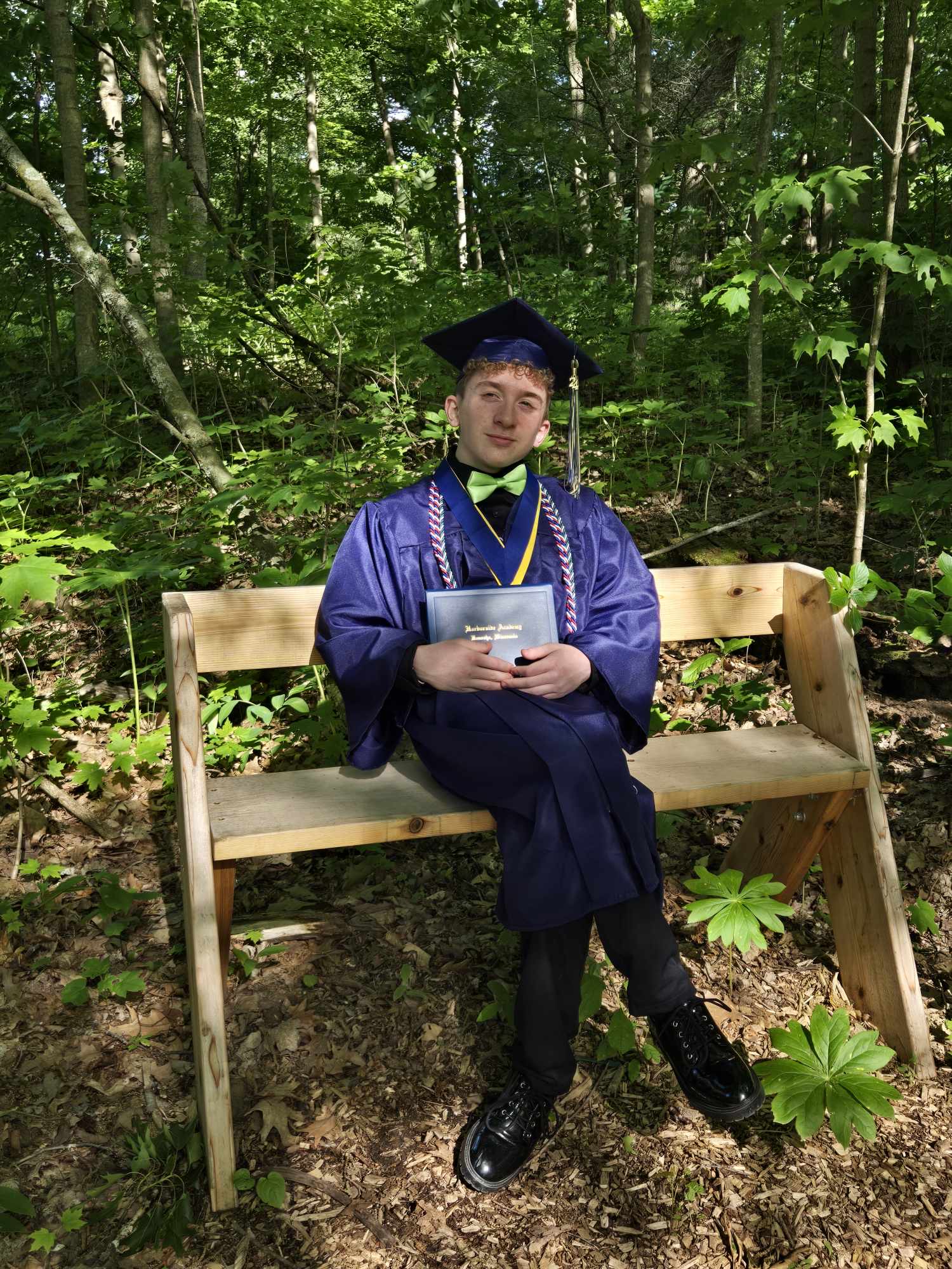 big aaron wearing graduation ghown